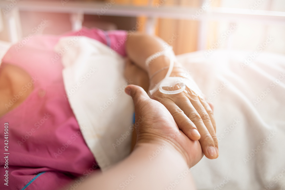 selective focus of patient's hand in hospital selective focus of patient's hand in hospital