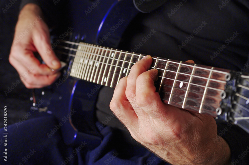 Guitarist hands playing guitar