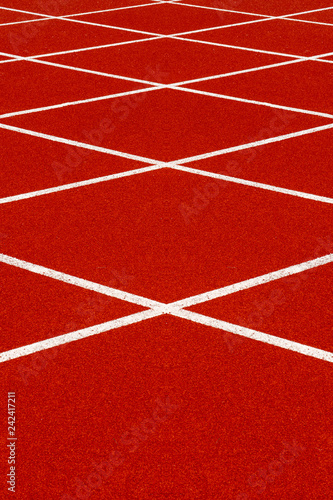 Red treadmill with white line at the stadium. © noppharat