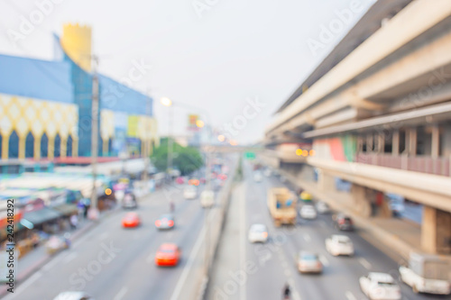 Blurry car driving on the road and sky train stations. © Nueng
