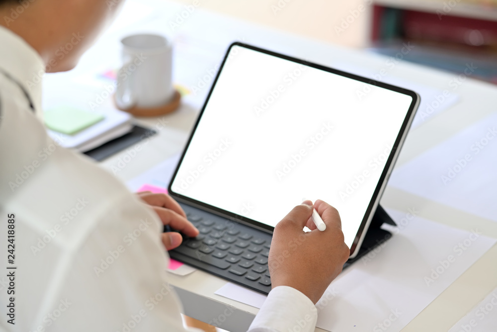 Business man working on tablet computer with blank copy space screen for your advertising graphic display Business man working on tablet computer with blank copy space screen for your advertising graphic display