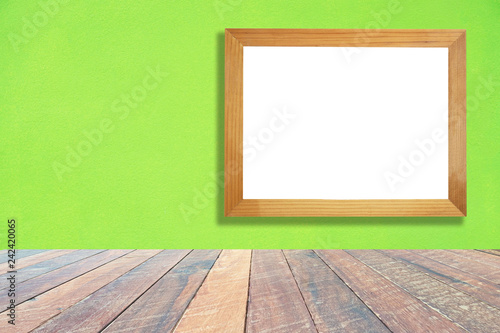 Green wall and empty wood desk and Wooden frame .Blank space for text and images.