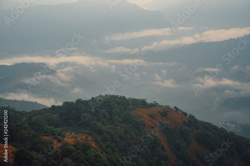 The scenic landscape of high mountains in the evening with Pavilion  viewpoint foreground  on top viewpoint mountain. Location  Pui Kho mountain in Northern Thailand