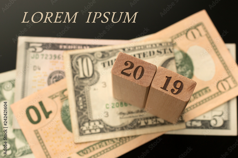 Number 2019 on the dollar banknotes background, Lorem ipsum words. Number 2019 on the dollar banknotes background, Lorem ipsum words.