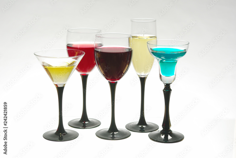 Five glasses with wines and cocktails
