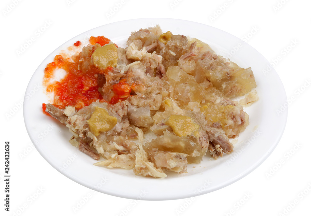 Scraps of meat jelly from pork and beef on a plate isolated Scraps of meat jelly from pork and beef on a plate isolated