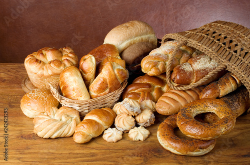 Bakery products. Loaves, rolls, loaves of bread on a wooden table