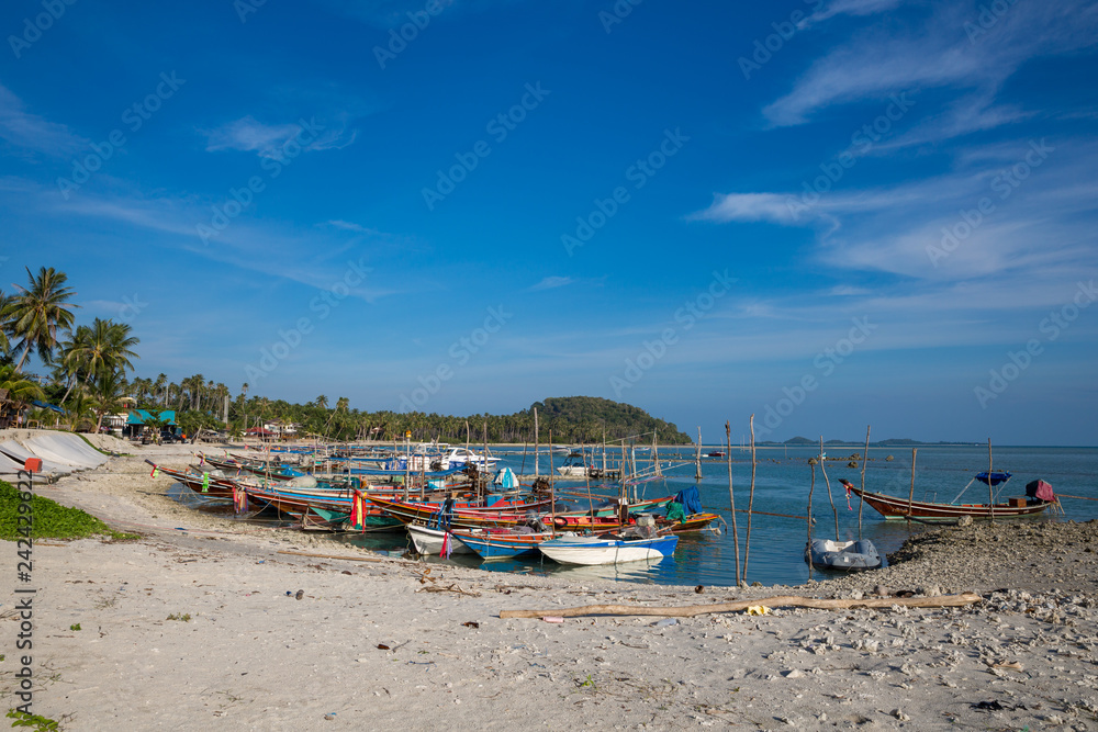 Fishing boats at the beach on Koh Samui in Thailand.