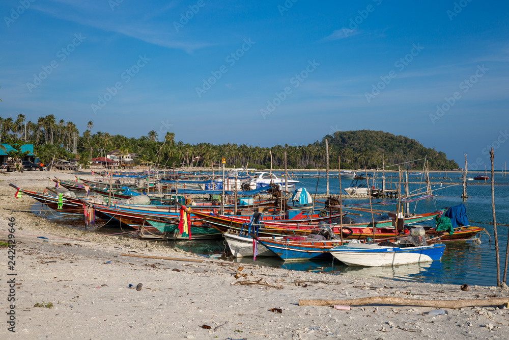 Fishing boats at the beach on Koh Samui in Thailand.