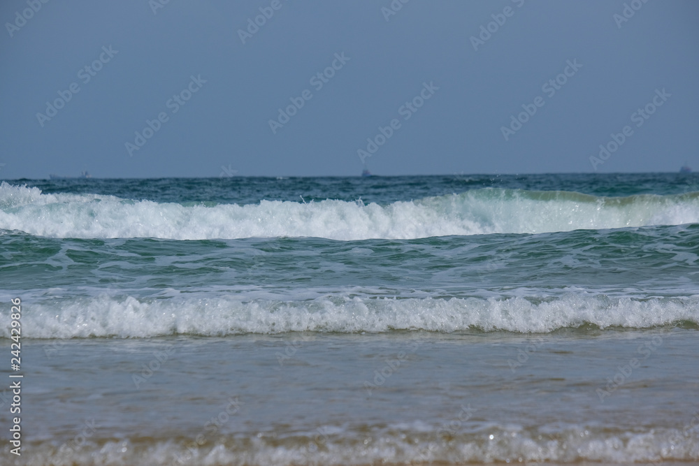Beautiful waves in the sea, amazing nature beach background. Royalty high-quality stock photo image ocean water, sea surface, sand. Turquoise waves, clear water surface background for tex and design