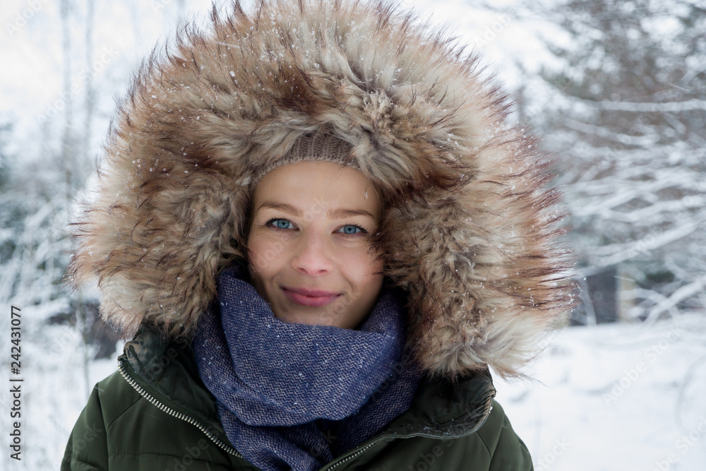 A young woman in warm clothes during winter A young woman in warm clothes during winter