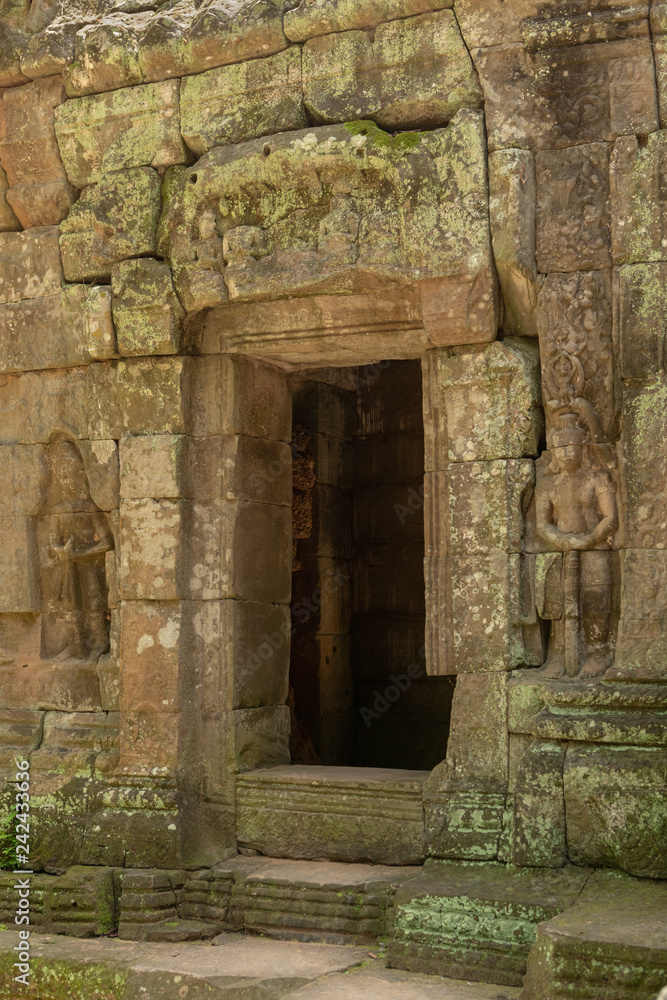 Decorated doorway and bas-reliefs at ruined temple