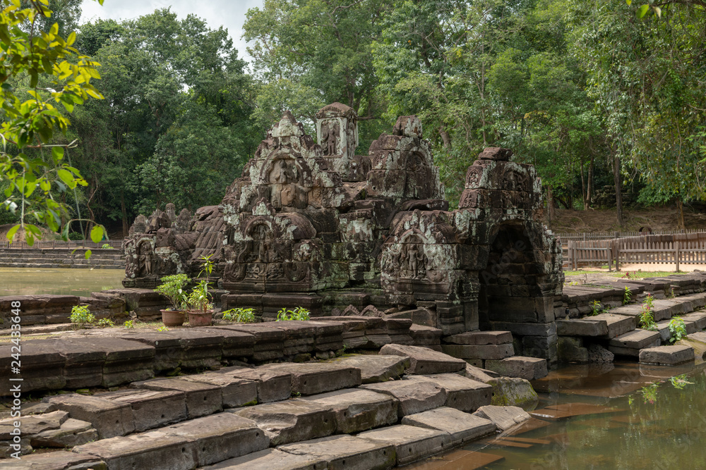 Decorative stone chamber and steps by pond Decorative stone chamber and steps by pond