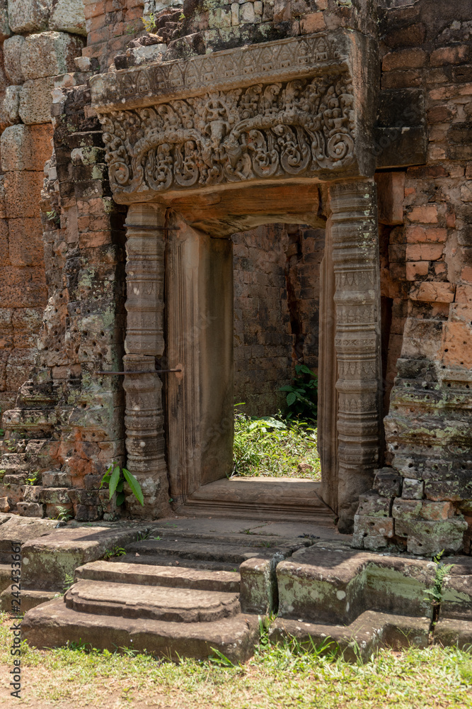 Doorway to stone temple with decorated pediment