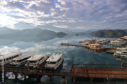 View of Sun Moon Lake with the passenger boats waiting at the numerous piers