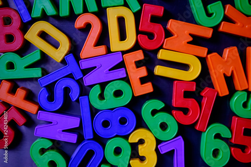 Colorful magnetic numbers and letters on the fridge