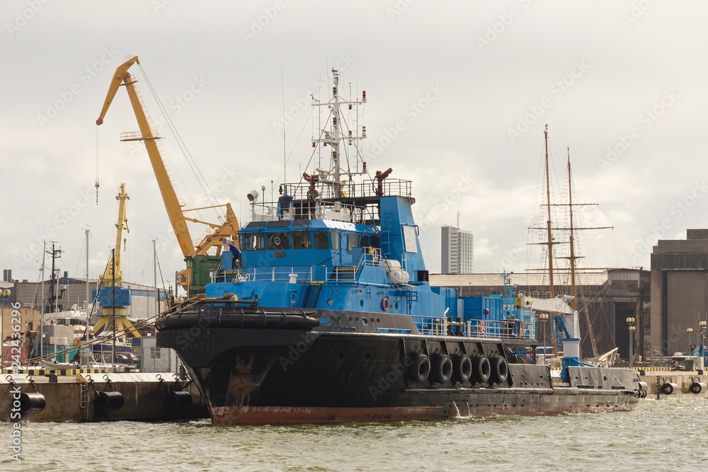 Offshore supply tug ship in the seaport.
