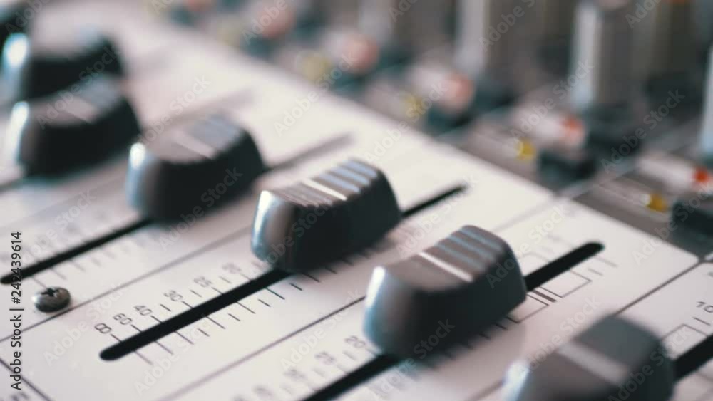 Control faders on a sound mixing console. Fade sliders controls on