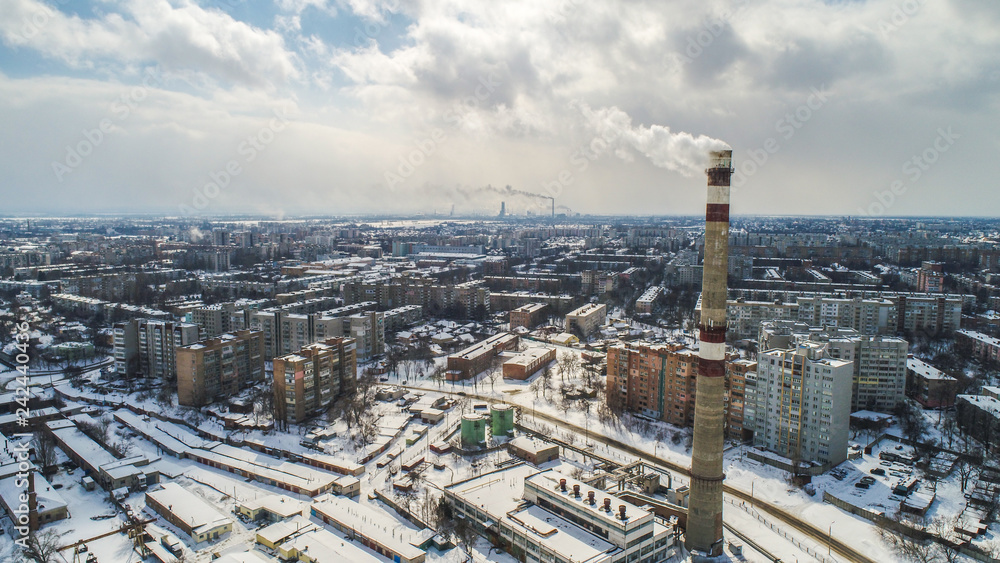 winter city pano with plant on front air photo winter city pano with plant on front air photo