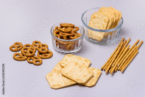 Salty Crackers Sticks Pretzels Top View Above Blue Background Party Snacks Mix Variety of Tasty Crackers for Beer
