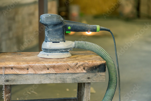 Fotografie Pneumatic sander machine close up.