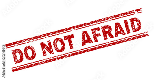 DO NOT AFRAID seal print with grunge texture. Red vector rubber print of DO NOT AFRAID title with unclean texture. Text title is placed between double parallel lines.