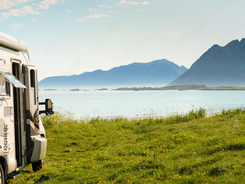 Camper van on sea shore, Lofoten Norway Camper van on sea shore, Lofoten Norway