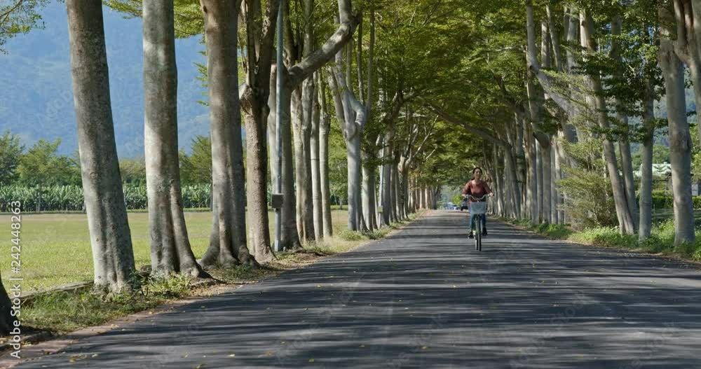 Woman ride a bike in the countryside Woman ride a bike in the countryside