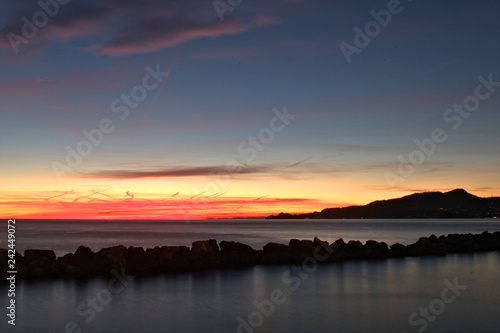 sunset over the sea,promontory of portofino,italy,horizon,nature,seascape,orange,clouds,evening,beautiful,view