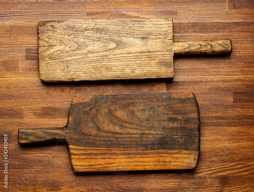 empty old cutting boards on wooden background , top view. Flat lay background.