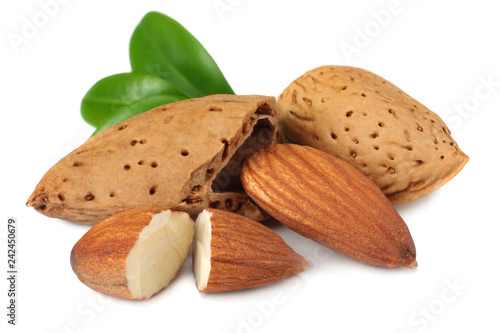 almond with green leaves isolated on white background