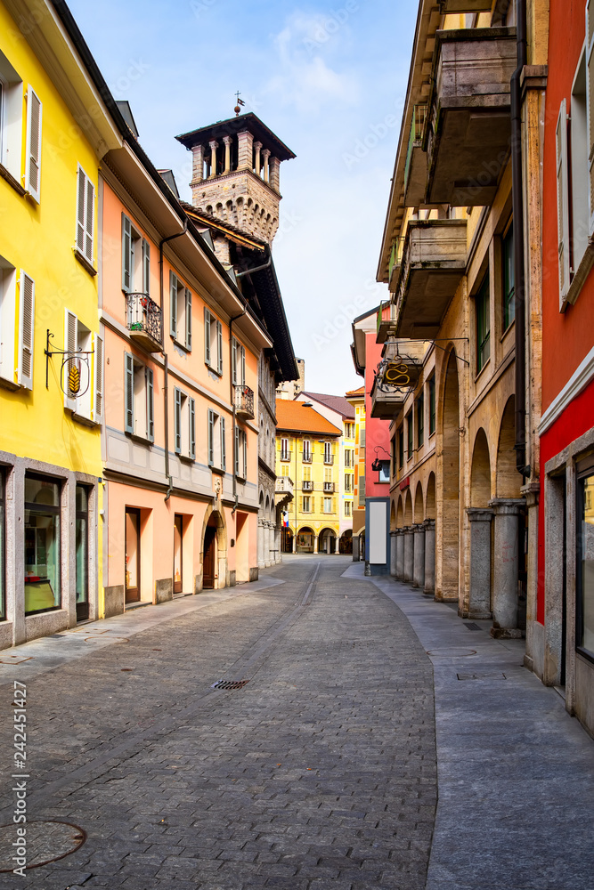 Street view and town hall tower of Palazzo Civico in Bellinzona, Ticino, Switzerland