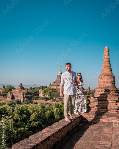 couple men and woma at the temple`s of Bagan Myanmar, temples and pagoda`s Bagan Myanmar sunset sunrise photo