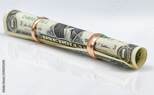 One-dollar bill rolled into a tube photo