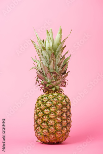 healthy, organic and sweet pineapple on pink background