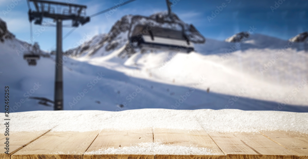 Fototapeta premium Desk with snow and frost with Alps mountains landscape 