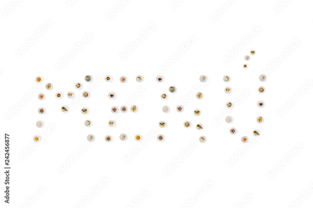 Word menu, written with photos of cooked food, in dishes from above Word menu, written with photos of cooked food, in dishes from above
