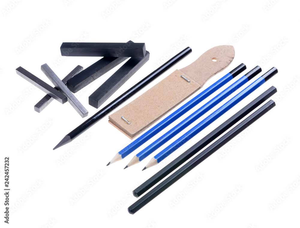 black chalk pastels arranged,set for black pencils and sandpaper isolated white background, graphics tools black chalk pastels arranged,set for black pencils and sandpaper isolated white background, graphics tools