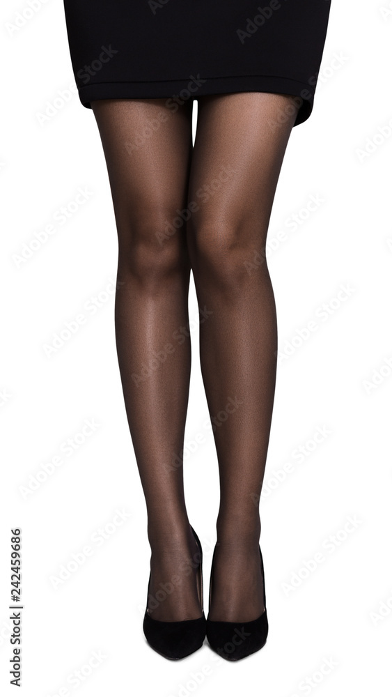 Unrecognizable woman wearing short skirt and black high heels. Unrecognizable woman wearing short skirt and black high heels.
