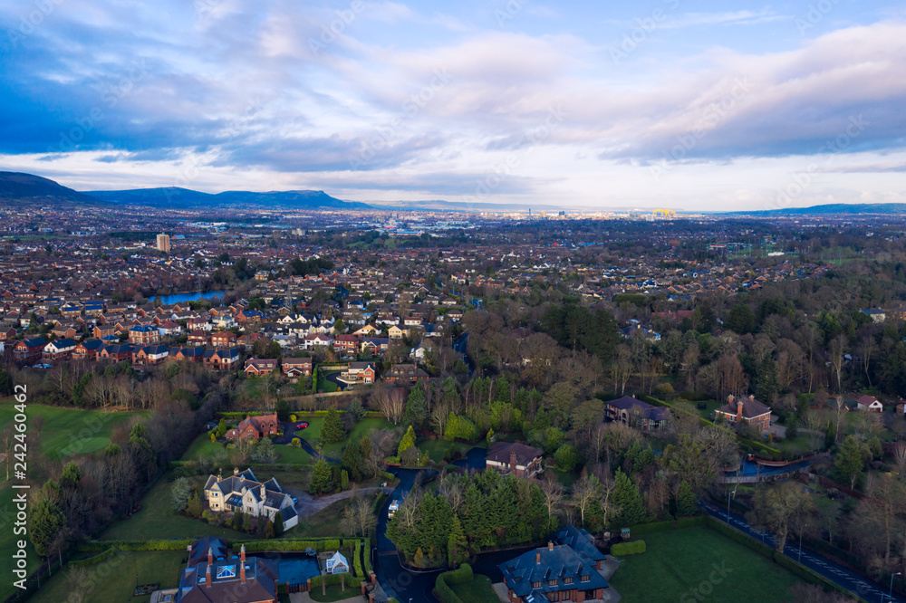 Fototapeta premium aerial view of Autumn countryside to the city during sunset time, Northern Ireland