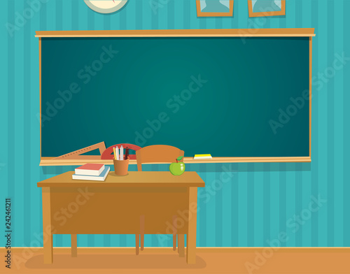 Interior of classroom with desk and blackboard.