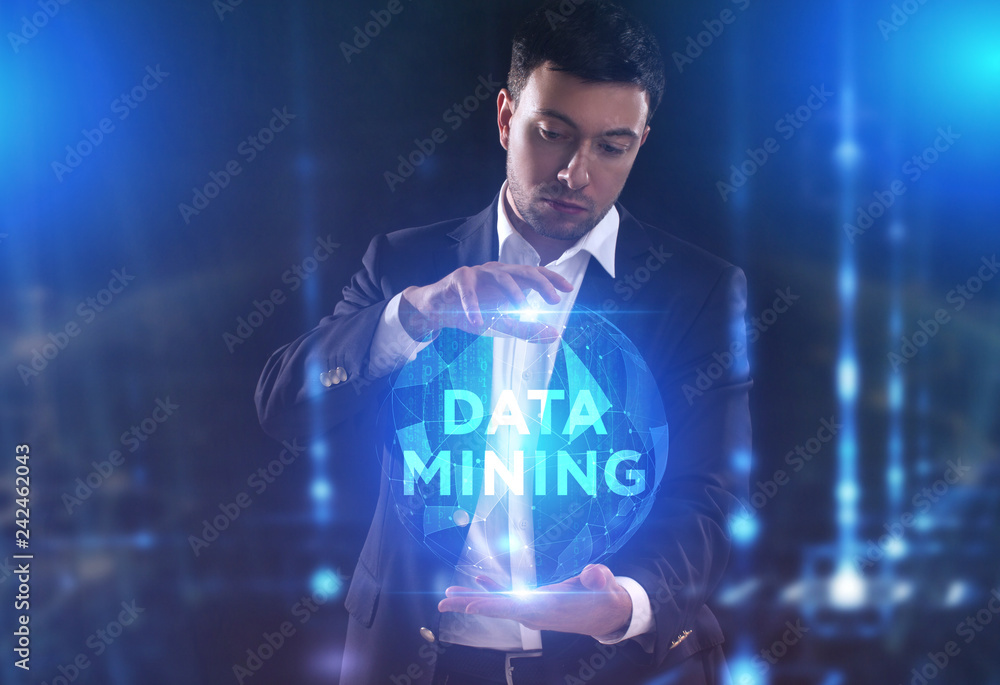 The concept of business, technology, the Internet and the network. A young entrepreneur working on a virtual screen of the future and sees the inscription: Data mining The concept of business, technology, the Internet and the network. A young entrepreneur working on a virtual screen of the future and sees the inscription: Data mining