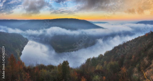 foggy canyon of a picturesque river. foggy autumn morning