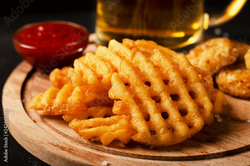 Crispy potato waffles fries, wavy, crinkle cut, criss cross cries photo