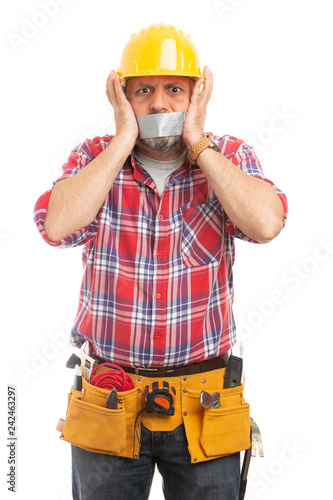 Constructor with duct tape on mouth . photo