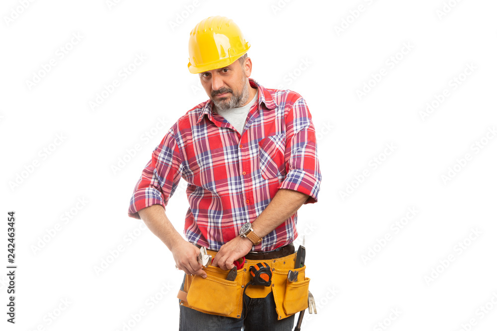 Constructor putting rope inside tool belt pocket. Constructor putting rope inside tool belt pocket.