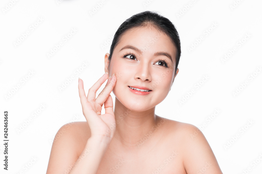 Skin care. Beautiful Young Asian Woman with Clean Fresh Skin touch her face