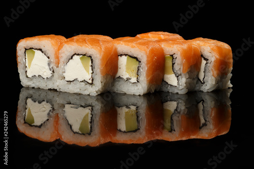 various sushi, rolls on a black background with reflection. especially for cafes and restaurants