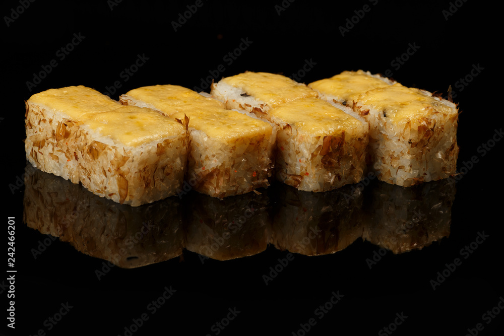 various sushi, rolls on a black background with reflection. especially for cafes and restaurants various sushi, rolls on a black background with reflection. especially for cafes and restaurants