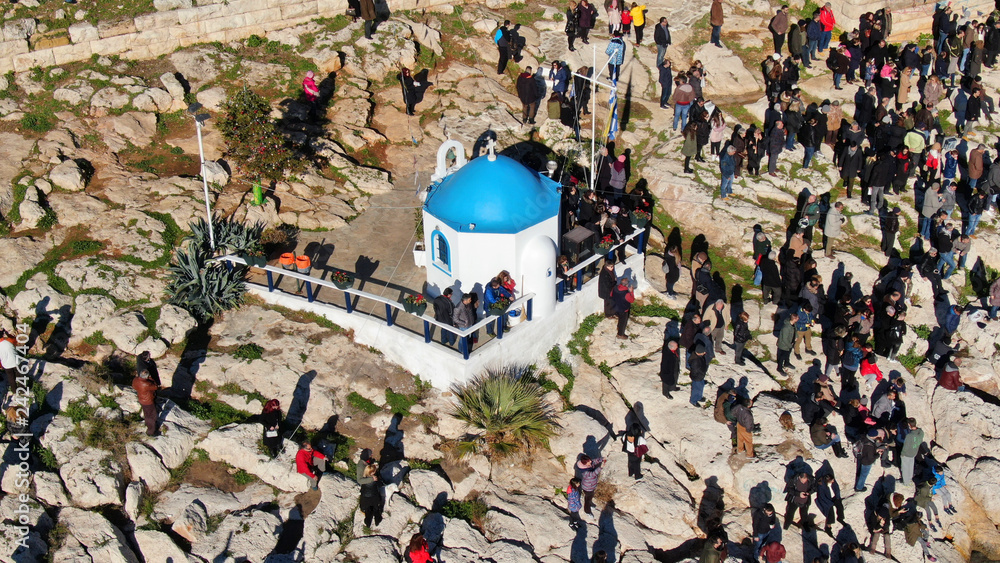Aerial drone photo of famous Christian ceremony of Epiphany in small port of Aphrodite, with iconic small chapel of Agios Nikolaos, Piraeus, Attica, Greece